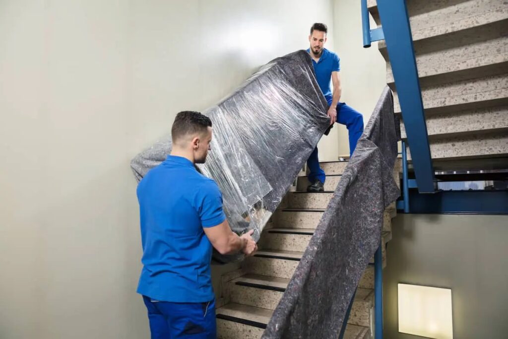 Walk Up Apartment Moving Service Chelsea Manhattan NY carrying furniture safely through apartment stairs