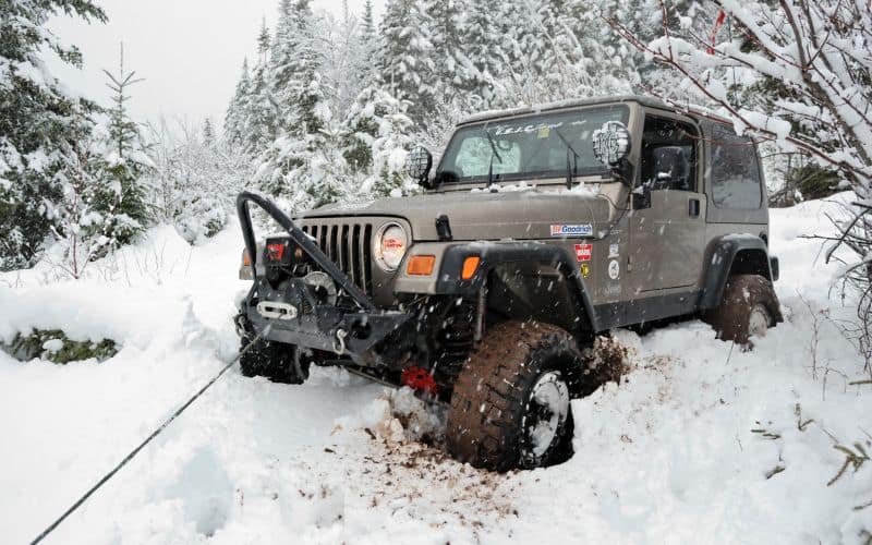 Winch Out Service Grosse Pointe MI recovering a stuck SUV from roadside mud