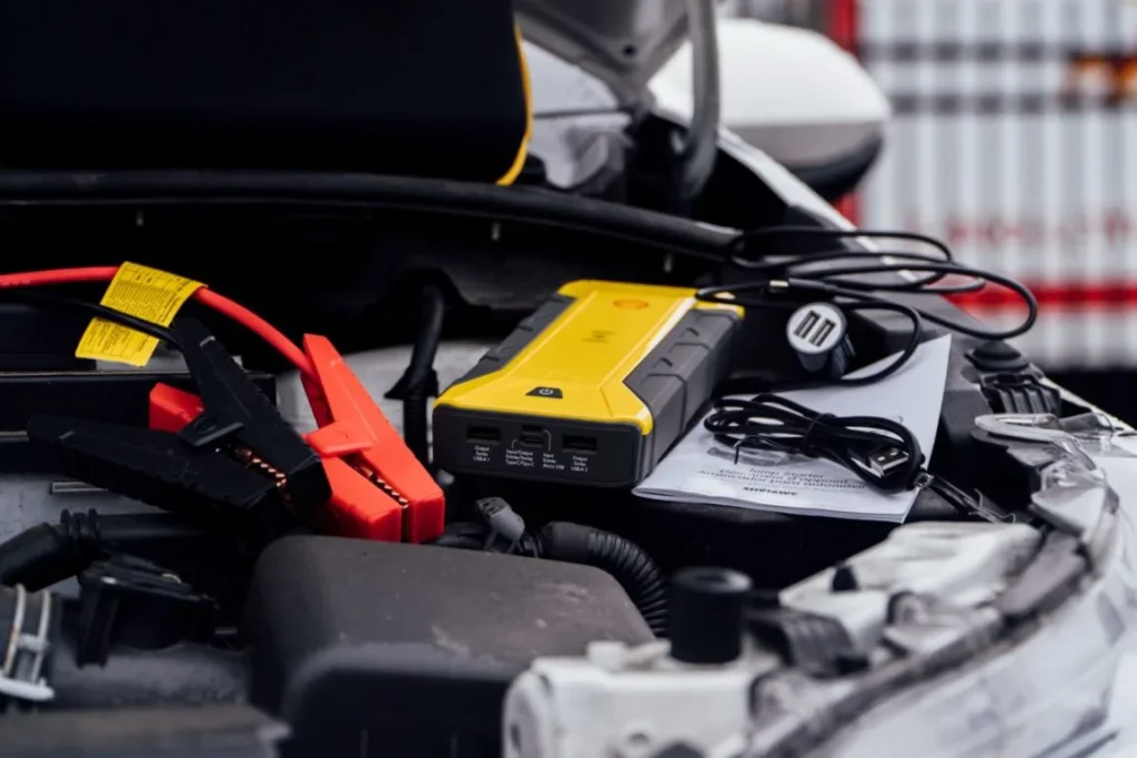 Certified technician performing mobile battery jump start Northville MI